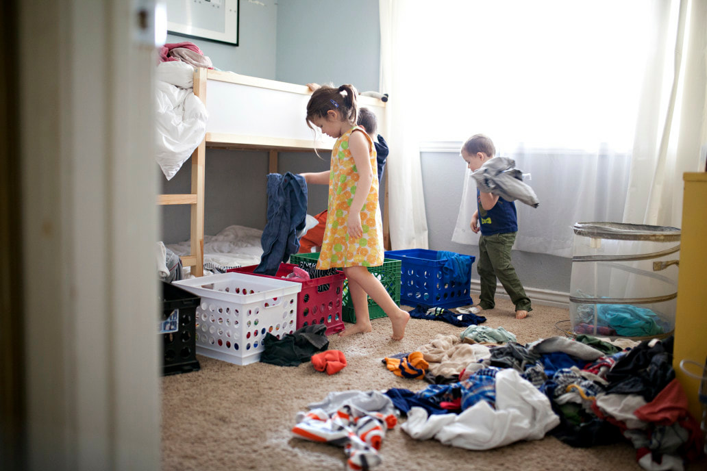 Kids sorting and organizing clothes. JAM Organizing: Professional Organizer in Wilmington, NC specializing in Home Organization and Home Office Organization. Blog Post: How to Organize Anything