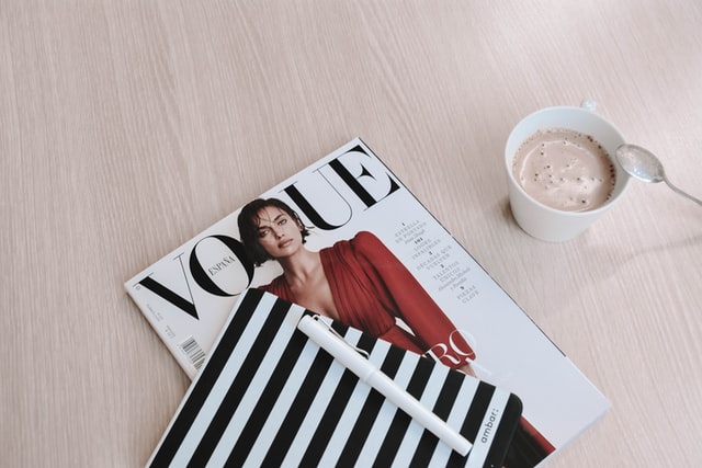 Vogue magazine next to a cup of a warm beverage. JAM Organizing: Professional Organizer in Wilmington, NC specializing in Home Organization and Home Office Organization. Covering New Hanover, Brunswick, Pender, Duplin, and Onslow Counties in NC and Horry County in SC. Blog Post: Guest Post: 6 Tips for Organizing Documents and Important Paperwork.