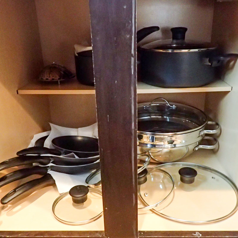 Client’s pots and pans after decluttering picture. Kitchen Organization by JAM Organizing: Professional Organizer in Wilmington, NC specializing in Home Organization and Home Office Organization. Blog Post: Visualization: The First Step to an Organized Space. 